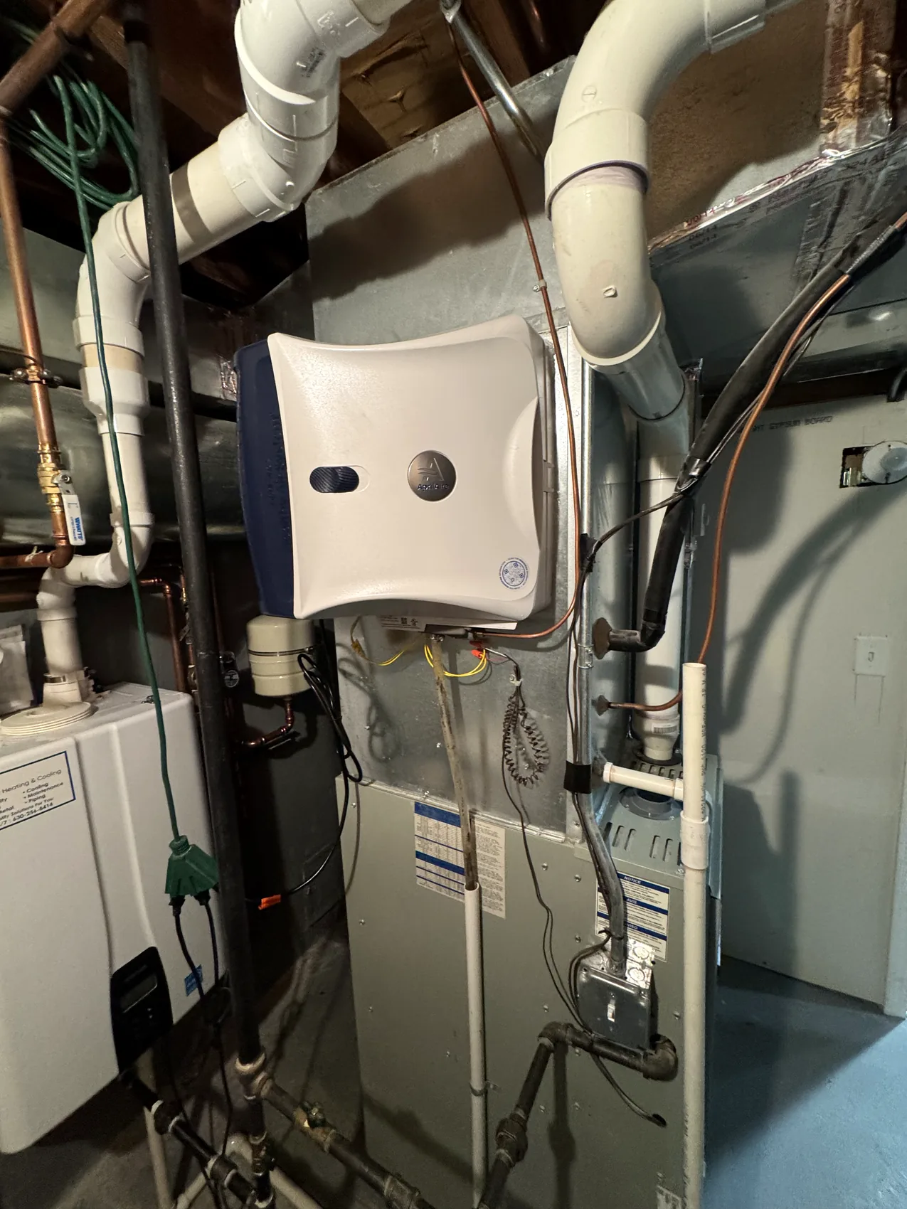 Installed tankless water heater and utility piping